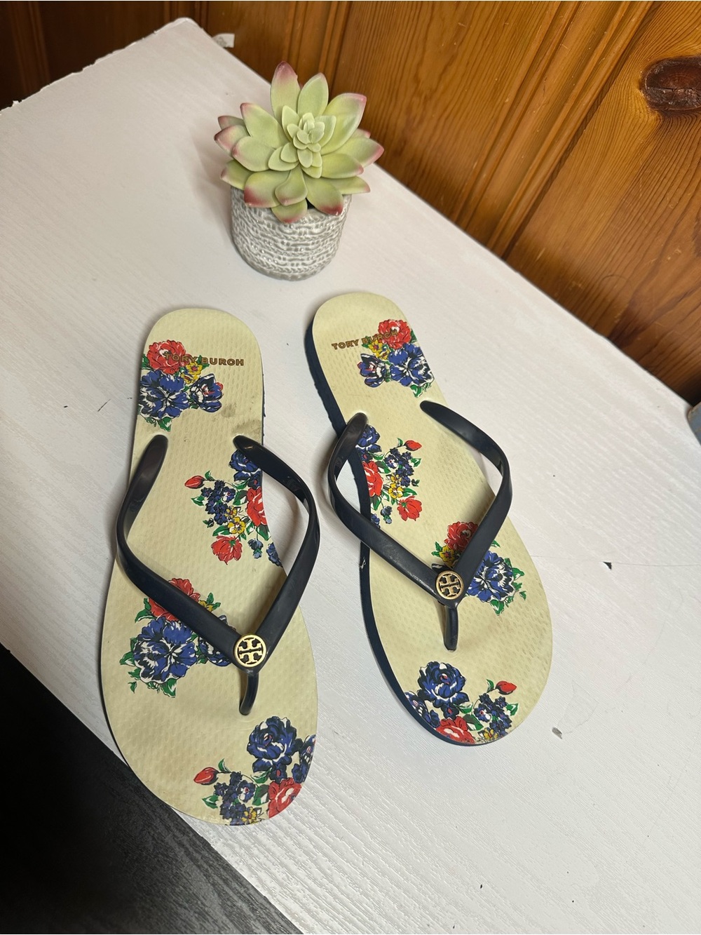 Tory Burch Cream Flip Flops with Navy Straps and Floral Print